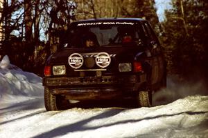 Mark Utecht / Diane Sargent Dodge Omni GLH-Turbo at speed over a crest before sunset.