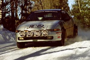 Rob Bohn / Todd Houtz Mitsubishi Eclipse at speed over a blind crest before sunset.