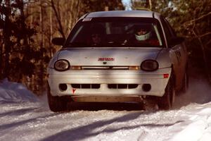 Mark Lapid / Mike Busalacchi Dodge Neon comes over a crest at speed before sundown.