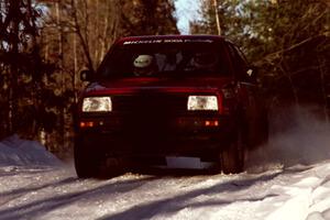 Brian Vinson / Richard Beels VW GTI at speed over a crest before sunset.