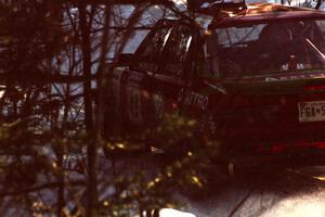 Carlos Arrieta, Sr. / Dick Casey Audi 4000 Quattro head downhill after a crest before sundown.