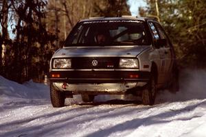 Art Burmeister / Randy Moore VW GTI at speed over a crest before sunset.