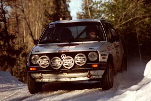 Doug Davenport / Al Kintigh VW Golf comes over a crest at speed before sunset.