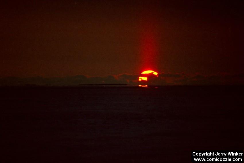 The sunset over Lake Michigan created a beam of light that went upward.