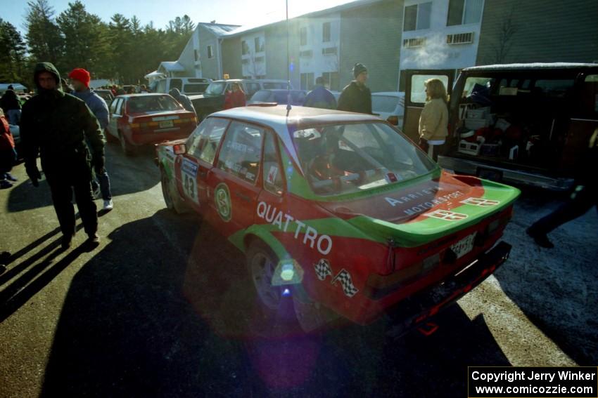Carlos Arrieta, Sr. / Dick Casey Audi 4000 Quattro prepares for tech inspection in front of the A-Win Sands Motel.