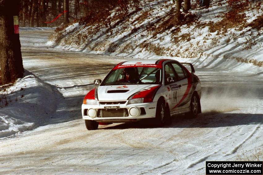 Garen Shrader / Doc Schrader get used to the new Mitsubishi Lancer Evo IV seen here at the SS1 spectator location.