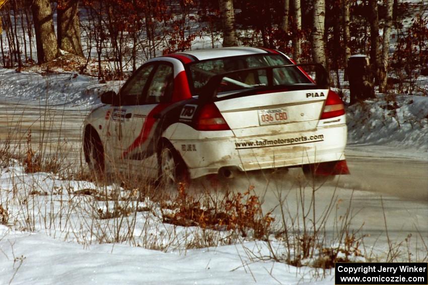 Garen Shrader / Doc Schrader ignore the set speed limit in their Mitsubishi Lancer Evo IV just after the SS1 spectator location.