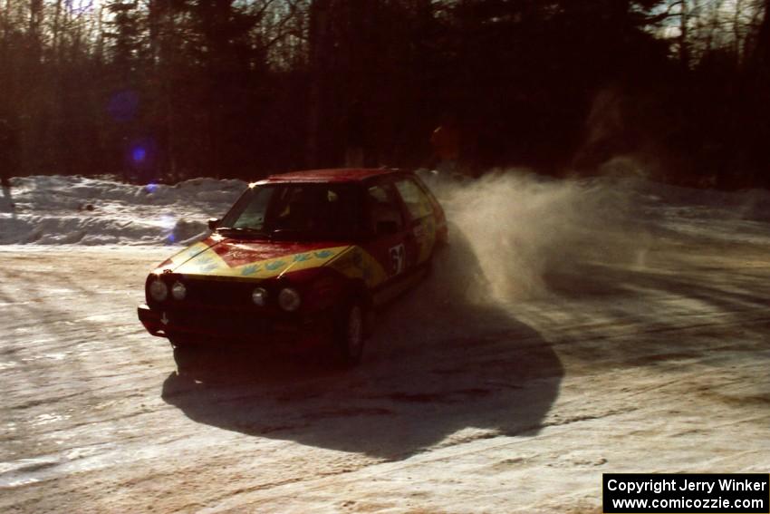 Karl Scheible / Gail McGuire drift their VW GTI perfectly through the SS1 spectator location.