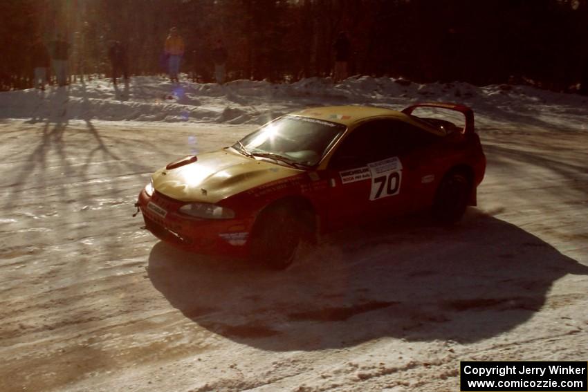 Tom Lawless / Sean Devine drift through a 90-left in their Eagle Talon at the SS1 spectator corner.