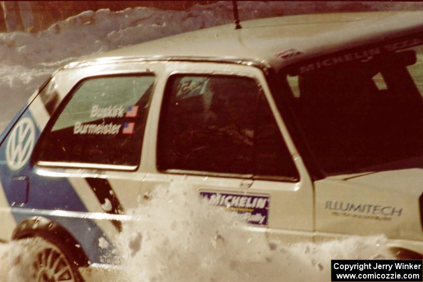 Eric Burmeister / Mark Buskirk VW GTI tags the outside bank at the SS1 spectator point.