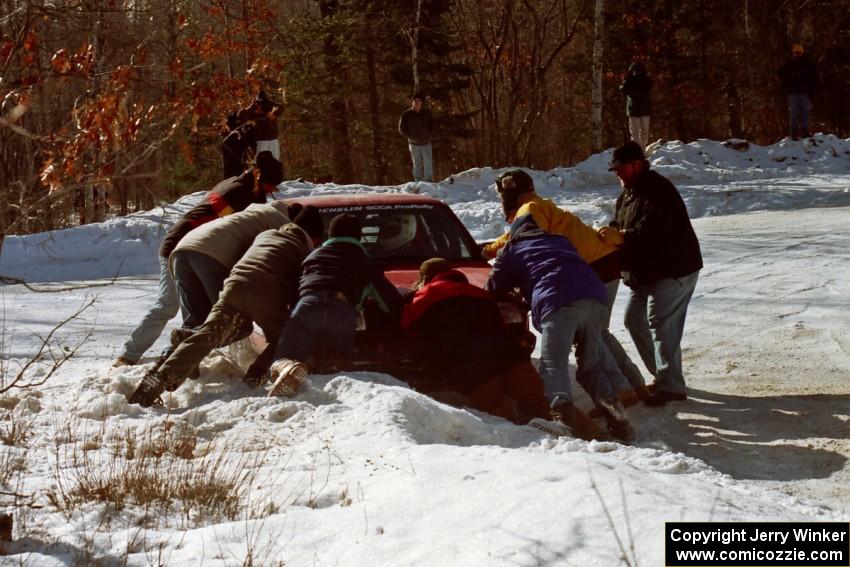 Brian Vinson / Richard Beels VW GTI gets pushed back out of the bank at the spectator corner on SS1.