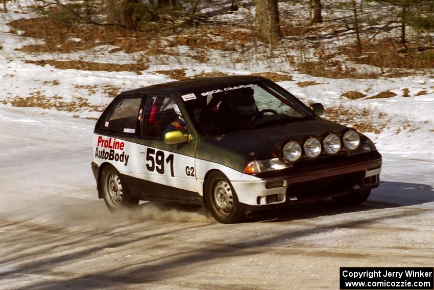 Dave Cizmas, Jr. / Dave Cizmas, Sr. Suzuki Swift at the spectator corner on SS1.