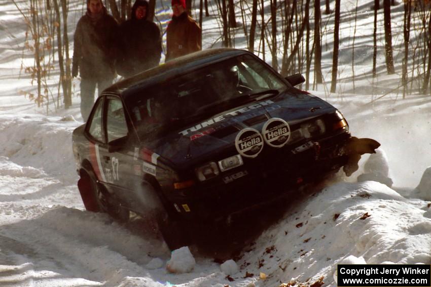 Lynn Dillon / J.B. Lewis encountered slippery conditions on SS3 and perched their Pontiac Sunbird on a snowbank.