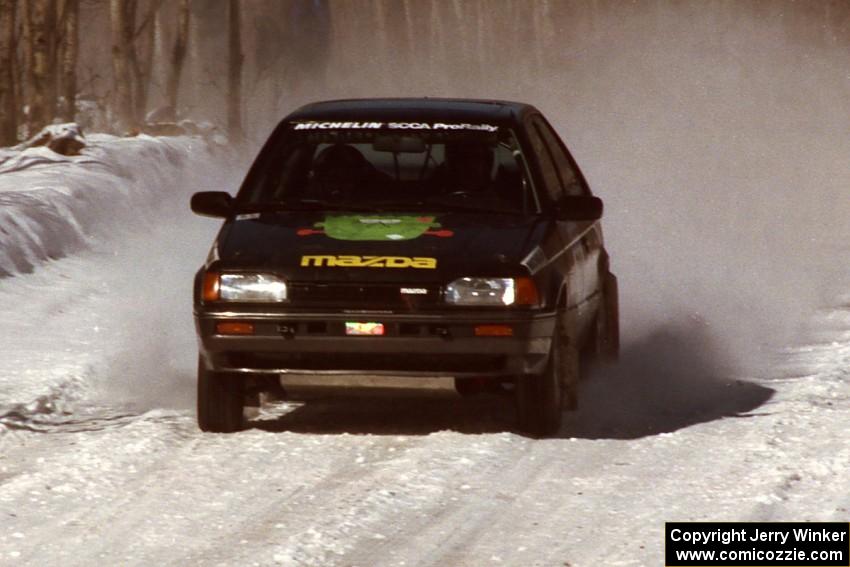 Tom Ottey / Pam McGarvey Mazda 323GTX comes into the flying finish of the stage before the first service.
