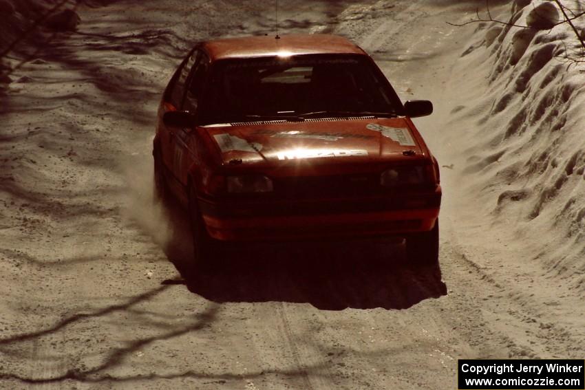 Gail Truess / Pattie Hughes at speed in their Mazda 323GTX after the first service.