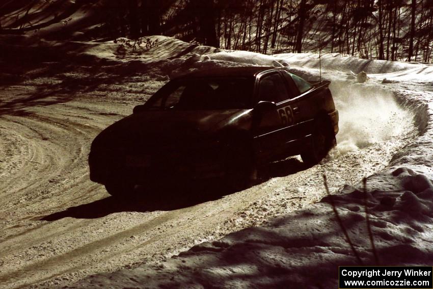 Celsus Donnelly / Brendan Lawless drift their Eagle Talon through a slippery downhill right-hander on the stage.