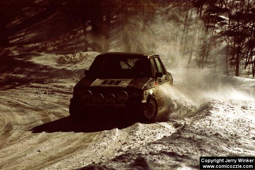 Eric Schroeder / Jeff Secor VW Jetta drifts wide at a downhill right-hander on the stage after the lunch break.