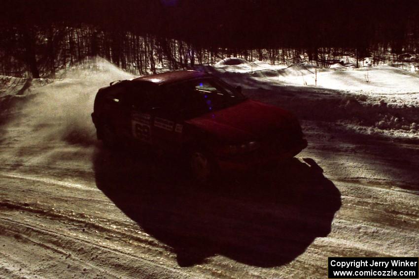 Charles Sherrill / Mark Rea Honda CRX slides wide on an icy corner on a stage after the lunch break.