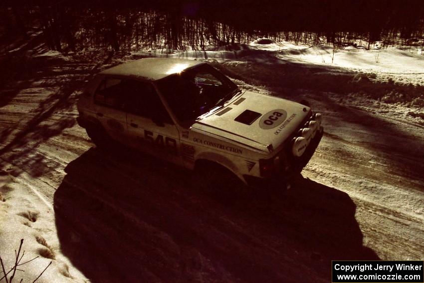 John Zoerner / Greg Reno Dodge Omni GLH-Turbo takes a slower line through a slippery corner on the stage after lunch.