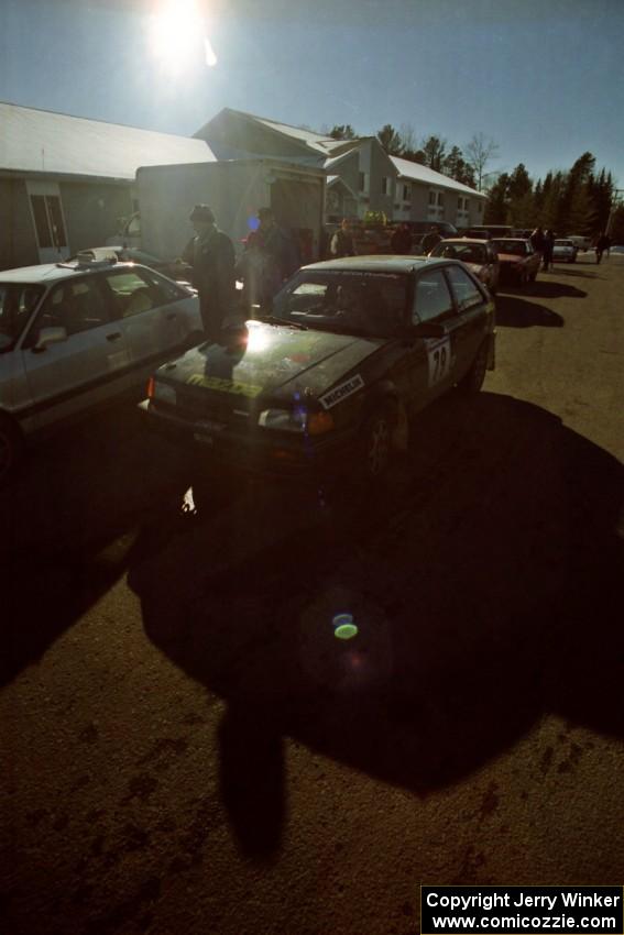 Tom Ottey / Pam McGarvey Mazda 323GTX prepares to go back out onto the stages after the midday break.