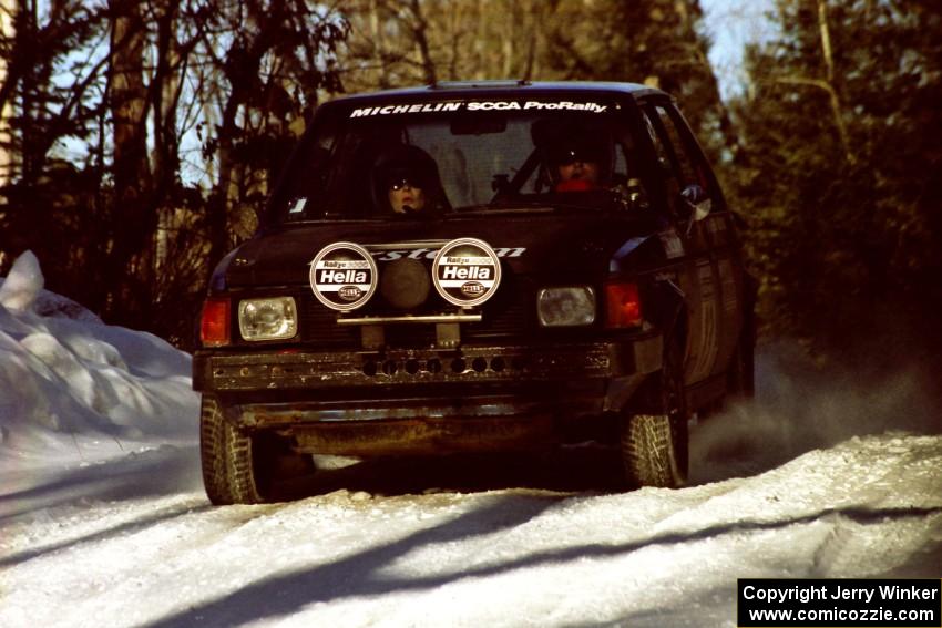 Mark Utecht / Diane Sargent Dodge Omni GLH-Turbo at speed over a crest before sunset.