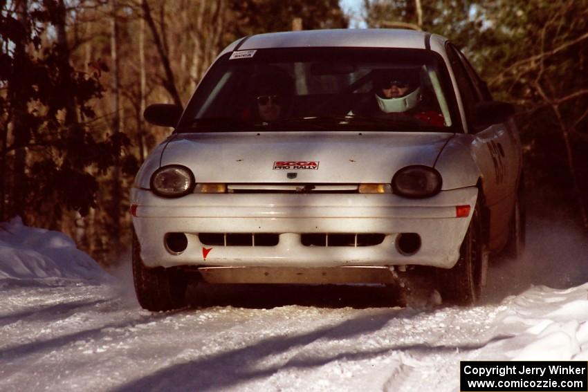 Mark Lapid / Mike Busalacchi Dodge Neon comes over a crest at speed before sundown.