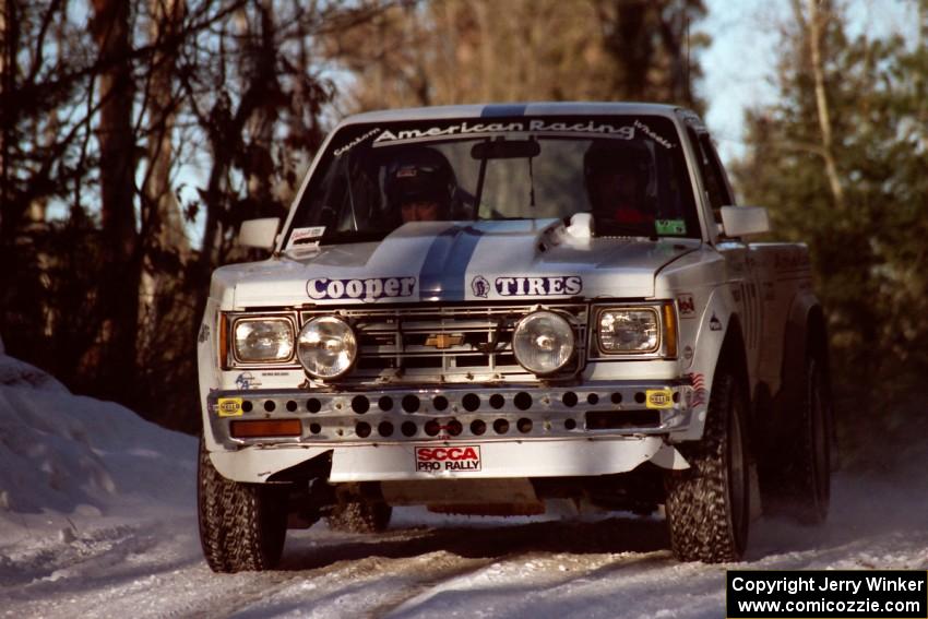 Ken Stewart / Jim Dale Chevy S-10 at speed over a crest before sunset.