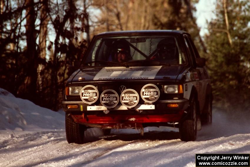 Eric Schroeder / Jeff Secor VW Jetta comes over a blind crest at speed before sunset.