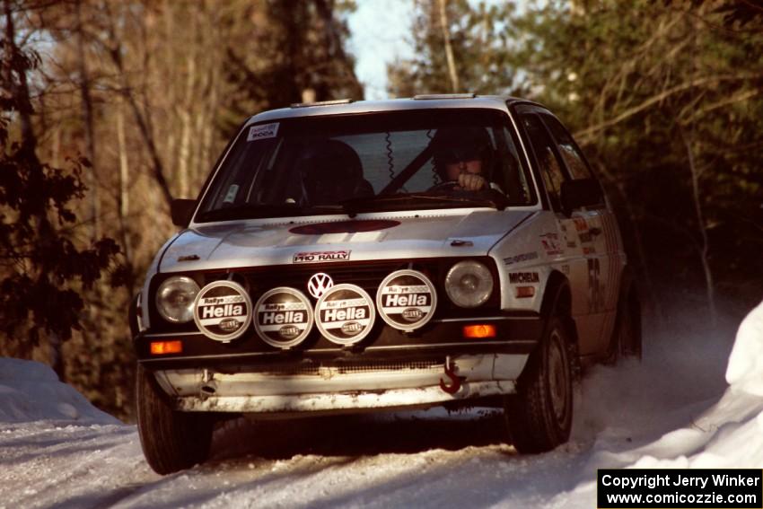 Doug Davenport / Al Kintigh VW Golf comes over a crest at speed before sunset.