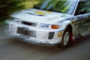 Gabriel Marin-Ortiz / Mark Williams Mitsubishi Lancer Evo V at speed on the practice stage.