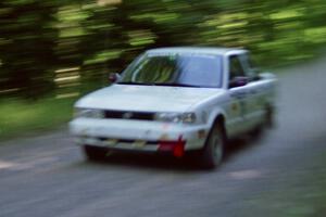 Ted Mendham / Lise Mendham Nissan Sentra SE-R at speed on the practice stage.