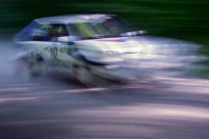 Marty Allen / Stewart Allen Mazda 323GTX at speed on the practice stage.