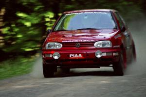 Chris Havas / Eric Tremblay VW Golf at speed on the practice stage.