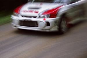 Garen Shrader / Doc Schrader Mitsubishi Lancer Evo IV at speed on the practice stage.