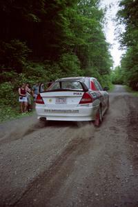 Garen Shrader / Doc Schrader Mitsubishi Lancer Evo IV leaves the start of the practice stage.