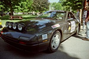 Jens Larsen / Claire Chizma Mazda RX-7 at the green in Wellsboro before the rally.