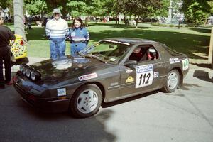 Jens Larsen / Claire Chizma Mazda RX-7 at the green in Wellsboro before the rally.