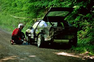 Celsus Donnelly / Kevin Mullan Eagle Talon changes a flat just past the FTC of SS1, Stony Crossing.