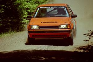 Gail Truess / Pattie Hughes Mazda 323GTX at speed on SS4, Cedar Run.