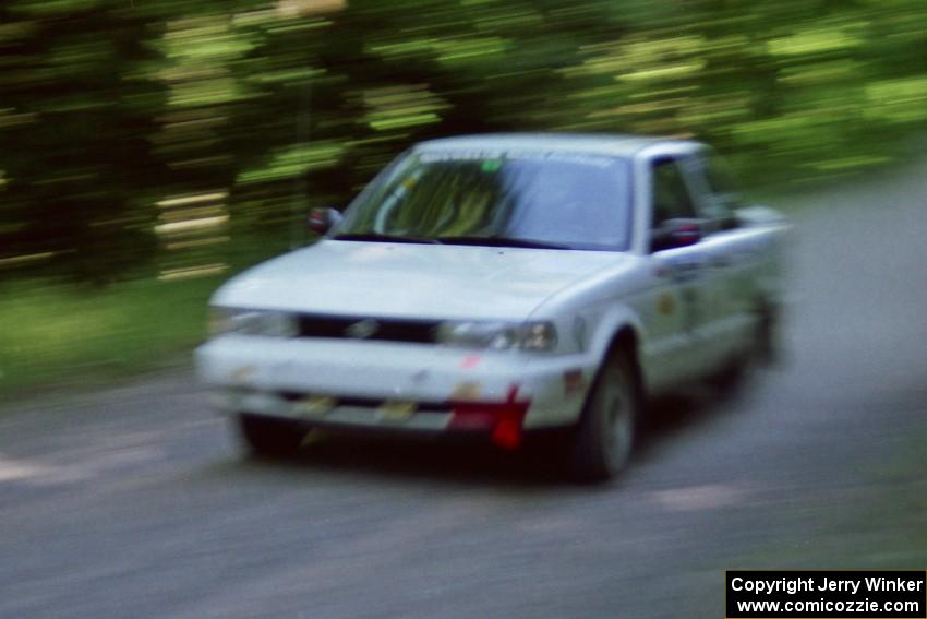 Ted Mendham / Lise Mendham Nissan Sentra SE-R at speed on the practice stage.