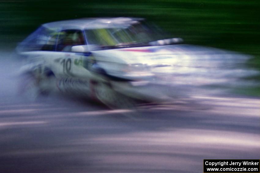 Marty Allen / Stewart Allen Mazda 323GTX at speed on the practice stage.