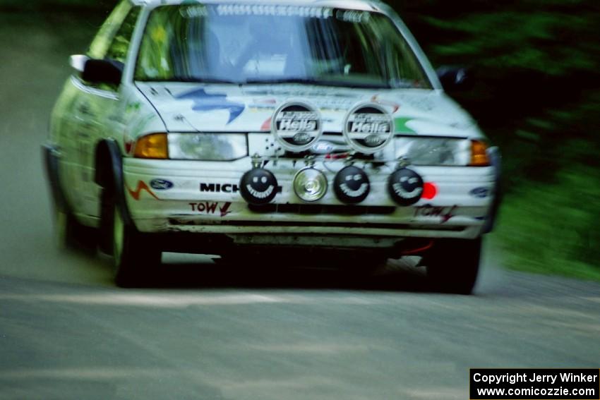 Charlie Langan / Hughie Langan Ford Escort GT at speed on the practice stage.