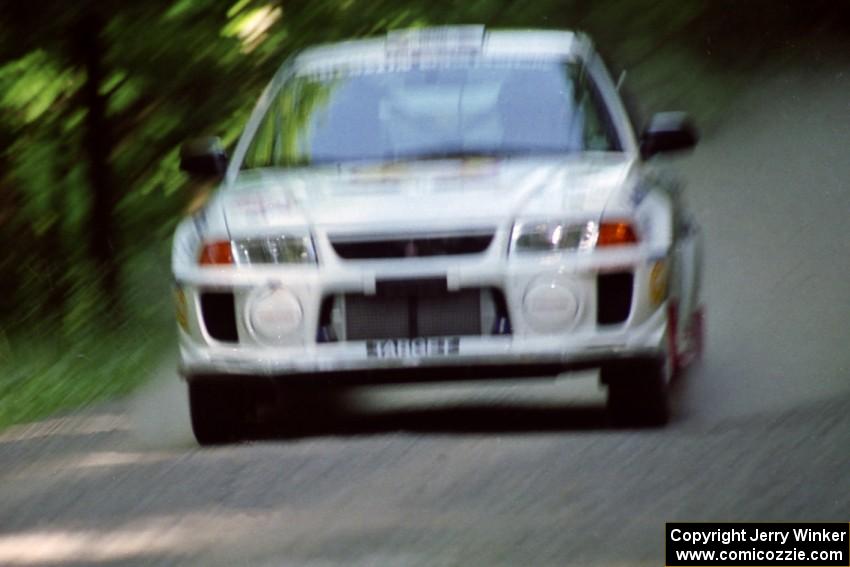 Gabriel Marin-Ortiz / Mark Williams Mitsubishi Lancer Evo V at speed on the practice stage.