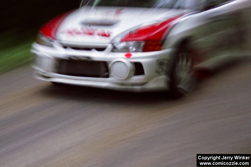 Garen Shrader / Doc Schrader Mitsubishi Lancer Evo IV at speed on the practice stage.