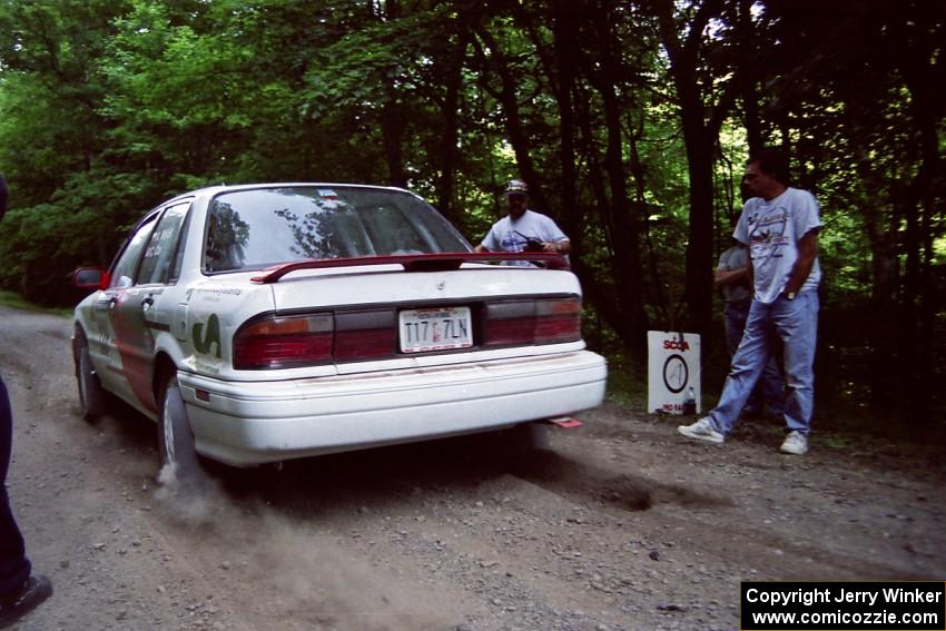 Arthur Wojcik / Chuck Cox Mitsubishi Galant VR-4 leaves the start of the practice stage.