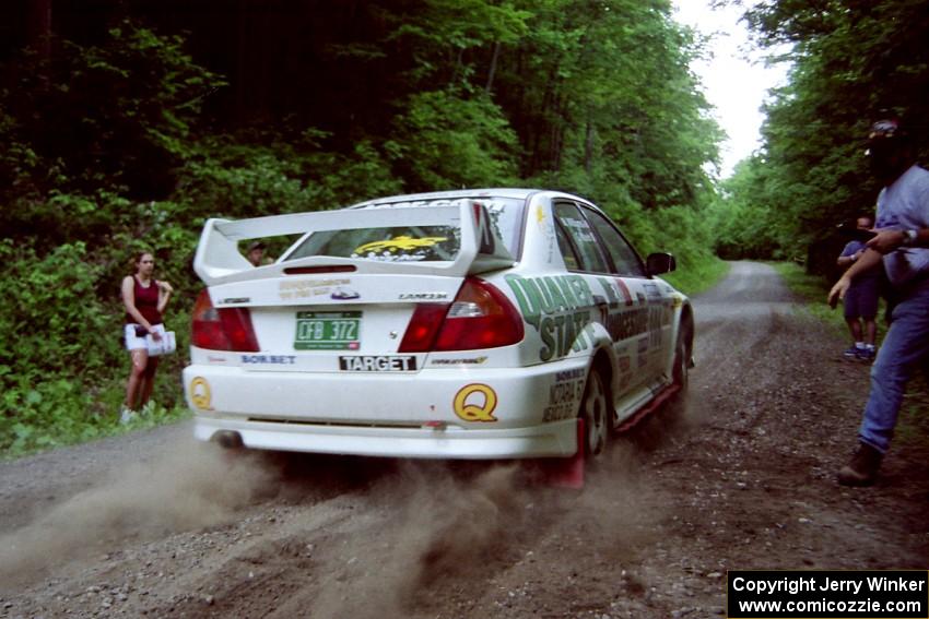 Gabriel Marin-Ortiz / Mark Williams Mitsubishi Lancer Evo V leaves the start of the practice stage.