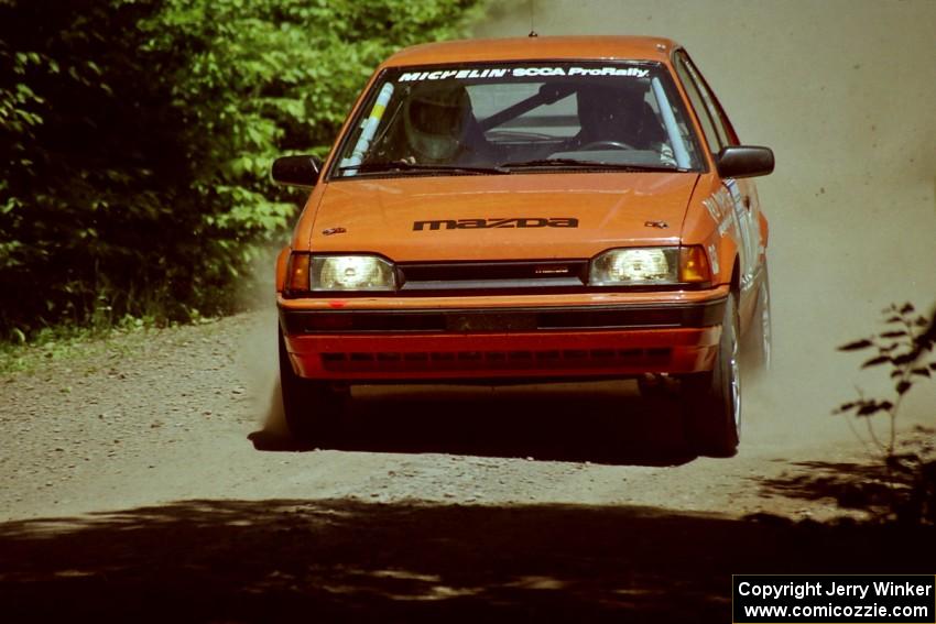 Gail Truess / Pattie Hughes Mazda 323GTX at speed on SS4, Cedar Run.