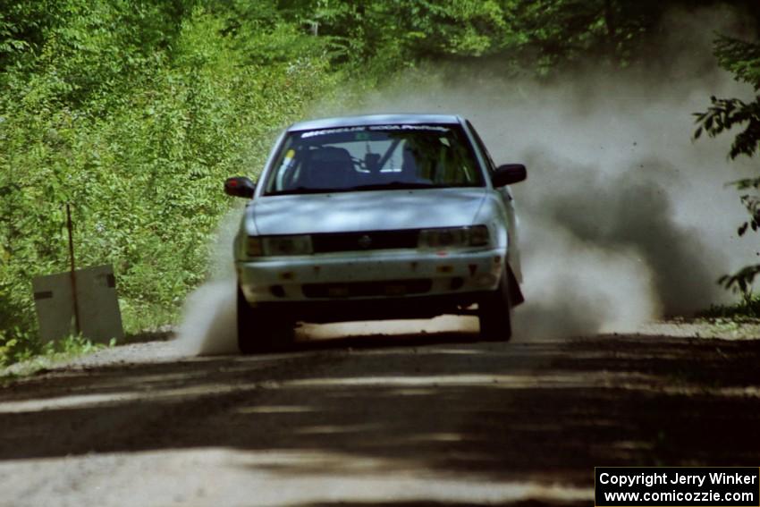 Ted Mendham / Lise Mendham Nissan Sentra SE-R crosses the finish of of SS4, Cedar Run.