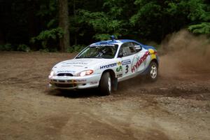 Paul Choiniere / Jeff Becker Hyundai Tiburon slides into a hairpin on SS5, Thompson Point I.