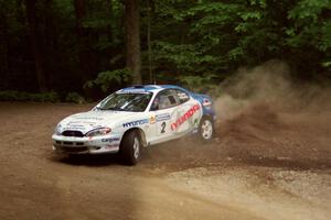 Noel Lawler / Charles Bradley Hyundai Tiburon slides into a hairpin on SS5, Thompson Point I.